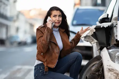 miserable-woman-crying-while-calling-help-mobile-phone-after-car-accident-1024x683 (1)
